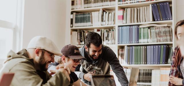 Students looking at a laptop